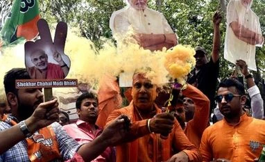 In pictures: When Modi-storm brought early Monsoon, Diwali for BJP workers .BJP supporters celebrate the party's lead in the 2019 Lok Sabha polls, on the vote counting day, outside the party headquarters in New Delhi on Thursday/PHOTO-DALIP KUMAR