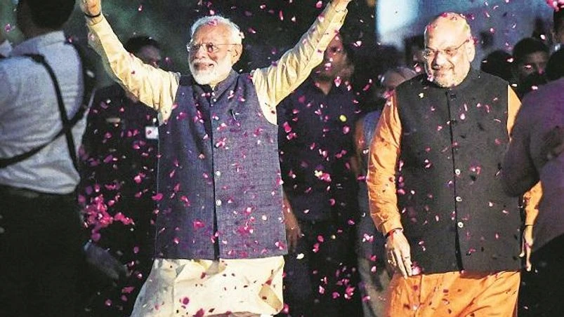 Modi, amit shah Prime Minister Narendra Modi (left) and BJP President Amit Shah receive a grand welcome at the party headquarters in New Delhi on Thursday | Photo: PTI