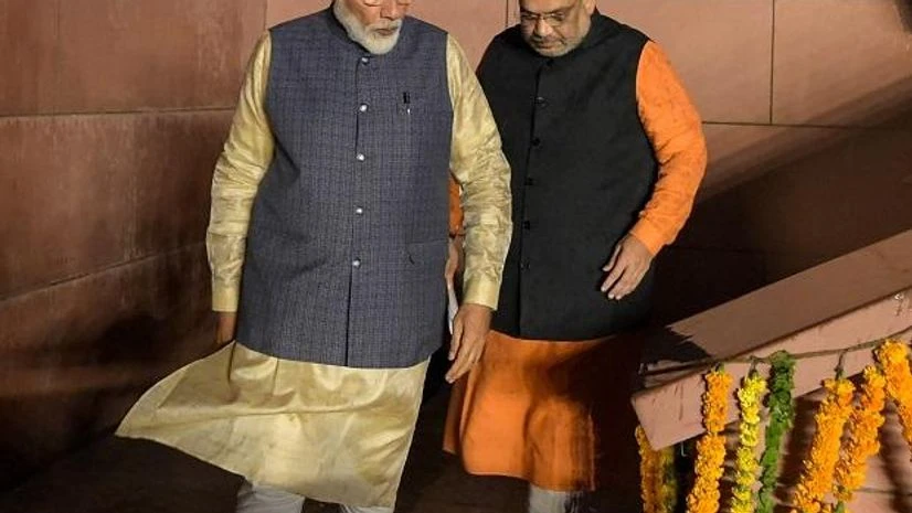 Modi, amit shah Prime Minister Narendra Modi along with the party President Amit Shah arrives at the party headquarters to celebrate their victory in the 2019 Lok Sabha elections, in New Delhi on Thursday | Photo: PTI