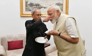 Modi meets Pranab Mukherjee to seek blessings, calls him 'a statesman' Narendra Modi meets former President Pranab Mukherjee