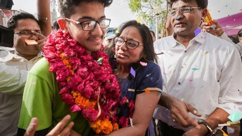 All India National Eligibility cum Entrance Test (NEET) topper Nalin Khandelwal celebrates with his parents after the declaration of results in Jaipur All India National Eligibility cum Entrance Test (NEET) topper Nalin Khandelwal celebrates with his parents after the declaration of results in Jaipur