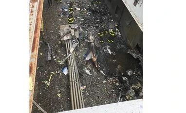 Helicopter crash-lands on New York City building, killing pilot Images from the scene of today's helicopter crash at 787 7th Ave. in Manhattan | Credits: @FDNY