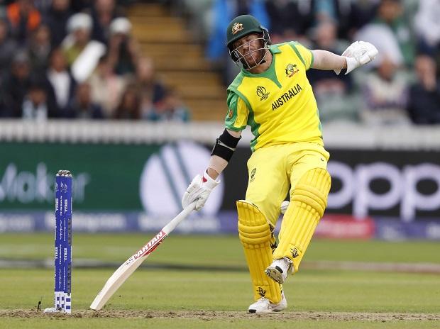 Australia's David Warner reacts as the ball is thrown towards his stumps in an attempted run out Australia's David Warner reacts as the ball is thrown towards his stumps in an attempted run out