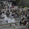 Riot police fire tear gas to protesters outside the Legislative Council in Hong Kong. | Photo: AP/PTI