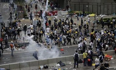 Police, protesters clash as stir takes aim at China border traders Hong Kong demonstrators