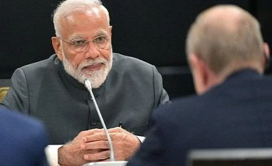 Juggling competing interests Indian Prime Minister Narendra Modi listens to Russian President Vladimir Putin, back to a camera, during their talks on a sideline of the Shanghai Cooperation Organization summit in Bishkek, Kyrgyzstan,