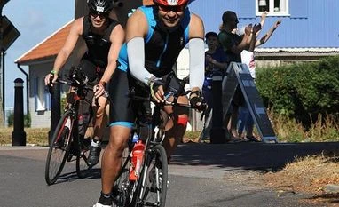 Ironman Ironman is a multi-sport endurance race involving a swim in open water, a bike ride and a run. You'll save time switching from swimming to cycling if you put on wear swim wear you can also bike in