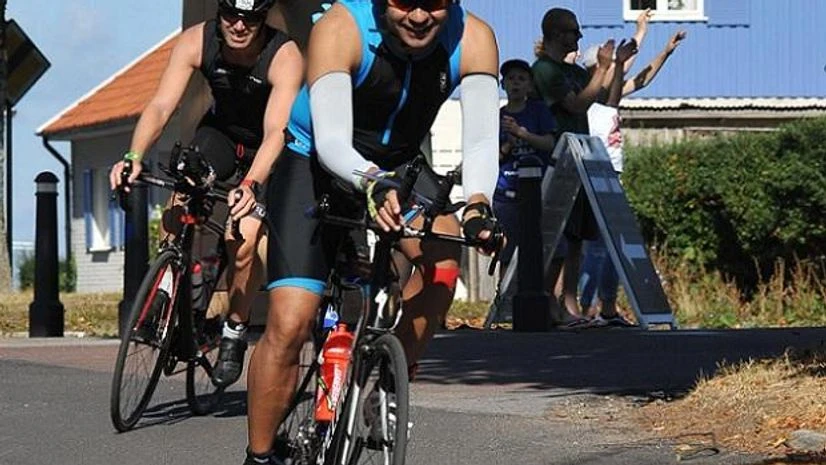 Ironman Ironman is a multi-sport endurance race involving a swim in open water, a bike ride and a run. You'll save time switching from swimming to cycling if you put on wear swim wear you can also bike in