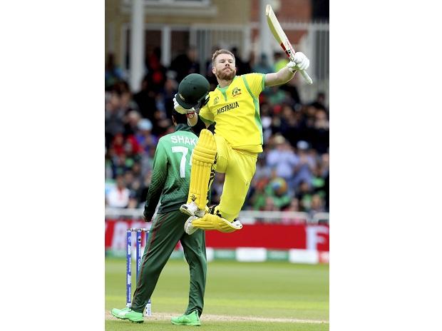 Australia's David Warner leaps in the air to celebrate scoring a century Australia's David Warner leaps in the air to celebrate scoring a century