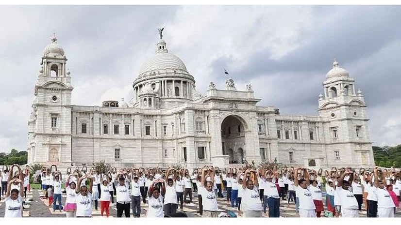CISF personnel along with others perform yoga during an event organised to mark the 5th International Day of Yoga, at Victoria Memorial ground in Kolkata CISF personnel along with others perform yoga during an event organised to mark the 5th International Day of Yoga, at Victoria Memorial ground in Kolkata