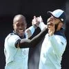 File photo of England's Jofra Archer, left, celebrates with a teammate the dismissal of Sri Lanka's captain Dimuth Karunaratne.
