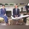 US President Donald Trump and Canada's PM Justin Trudeau sit behind a scale model of Air Force One as they meet in the Oval Office at White House in Washington, late on Thursday US President Donald Trump and Canada’s PM Justin Trudeau sit behind a scale model of Air Force One as they meet in the Oval Office at White House in Washington, late on Thursday