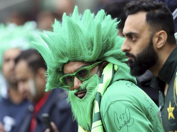 A Pakistan fan wait as rain delayed the start of play during the Cricket World Cup match A Pakistan fan wait as rain delayed the start of play during the Cricket World Cup match