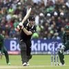 New Zealand's batsman James Neesham, middle, reacts after playing a shot as Pakistan's captain Sarfaraz Ahmed, right and teammate watches on