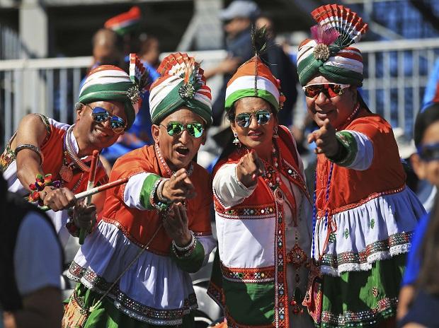 Indian cricket fans, dressed in the colors of their national flag Indian cricket fans, dressed in the colors of their national flag