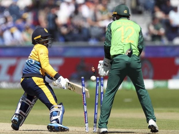 Sri Lanka's batsman Dhananjaya de Silva, is bowled as South Africa's wicketkeeper Quinton de Kock watches on Sri Lanka's batsman Dhananjaya de Silva, is bowled as South Africa's wicketkeeper Quinton de Kock watches on