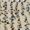 People enjoy bathing at a beach by the Baltic Sea in Travemuende, Germany, June 30, 2019