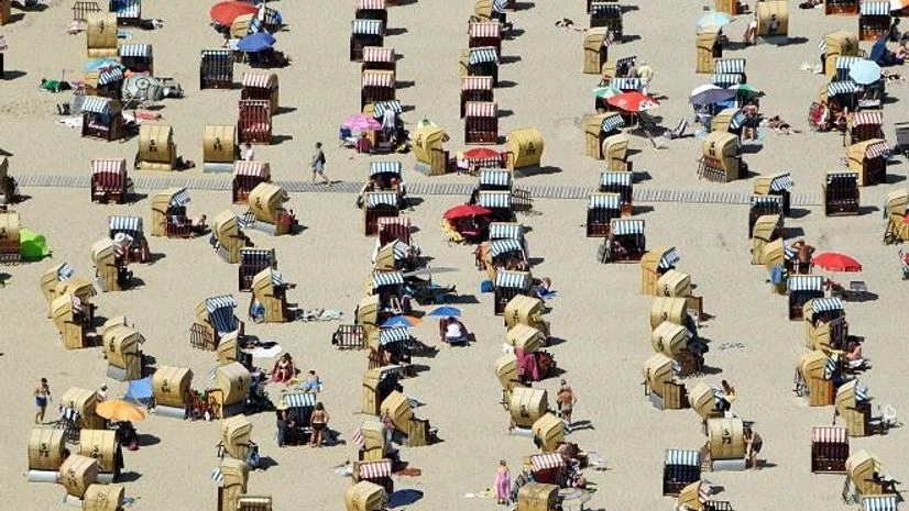 People enjoy bathing at a beach by the Baltic Sea in Travemuende, Germany, June 30, 2019 People enjoy bathing at a beach by the Baltic Sea in Travemuende, Germany, June 30, 2019