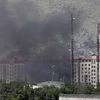 Smoke rises from the site of a blast and gunfire in Kabul