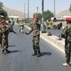 Afghan security forces arrive at the site of an explosion in Kabul