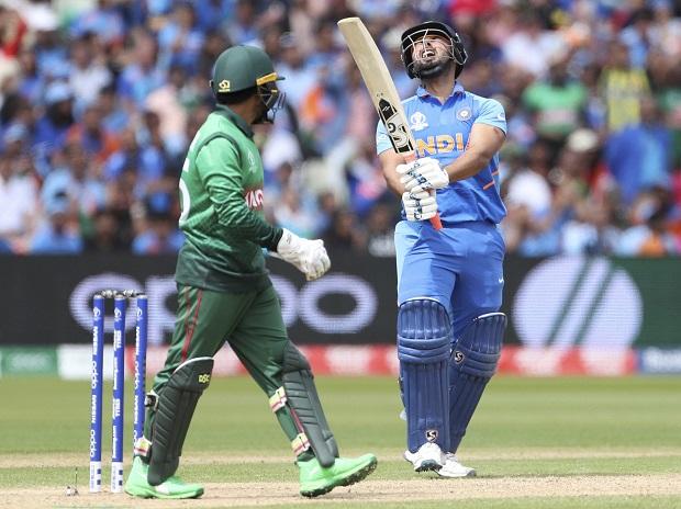 India's Rishabh Pant, right, reacts after being dismissed by Bangladesh's Shakib Al Hasan India's Rishabh Pant, right, reacts after being dismissed by Bangladesh's Shakib Al Hasan