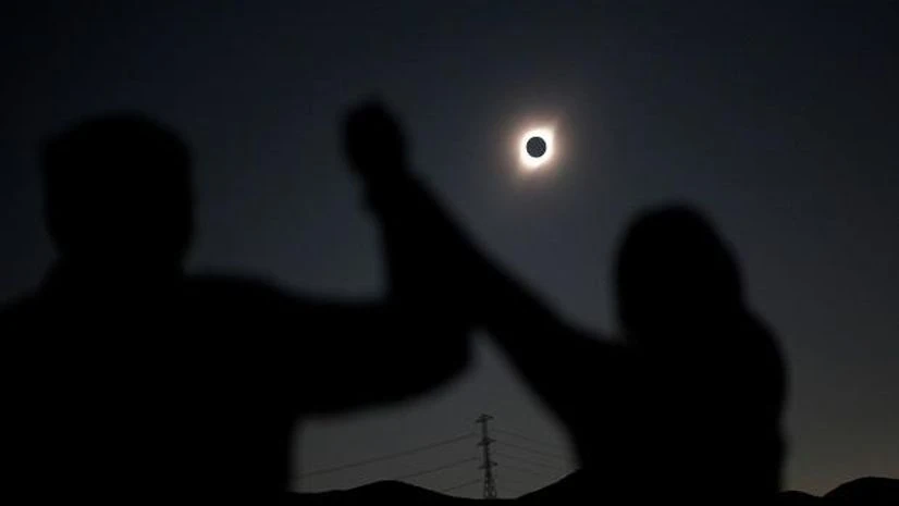 People react while observing a solar eclipse at Incahuasi, Chile People react while observing a solar eclipse at Incahuasi, Chile