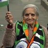 87-year-old Charulata Patel holds Indian flag and cheers for team India before a match between India and Bangladesh in ICC CWC 2019 at Edgbaston in Birmingham on Tuesday | Photo: ANI