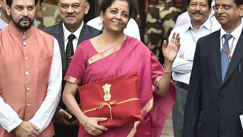 Nirmala Sitharaman, Anurag Thakur Finance Minister Nirmala Sitharaman with MoS Anurag Thakur and others outside the North Block ahead of the presentation of Union Budget 2019-20 at Parliament