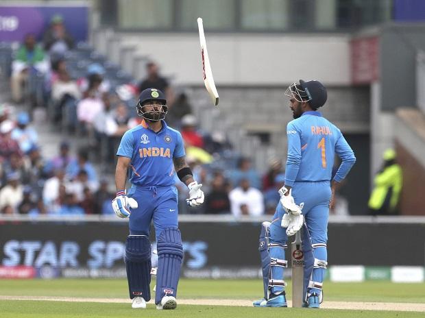 India's captain Virat Kohli, left, throws his bat in frustration after being dismissed by New Zealand's Trent Boult India's captain Virat Kohli, left, throws his bat in frustration after being dismissed by New Zealand's Trent Boult