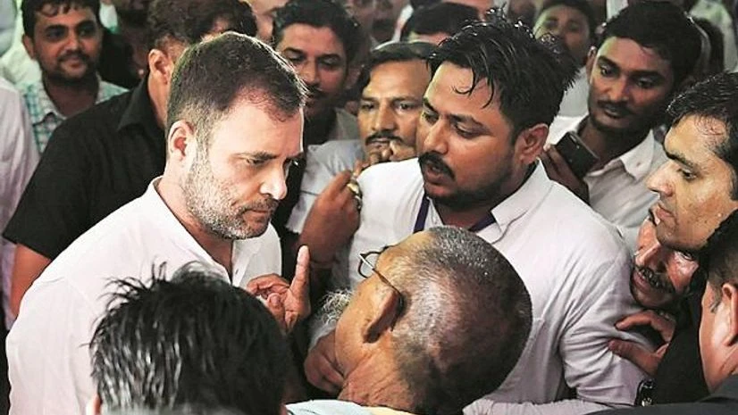Congress leader Rahul Gandhi listens to a party worker during his visit to Amethi on Wednesday | Photo: PTI Congress leader Rahul Gandhi listens to a party worker during his visit to Amethi on Wednesday | Photo: PTI
