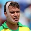 Australia's Alex Carey talks to teammate Adam Zampa during a drinks break after he was hit off the bowling of England's Jofra Archer