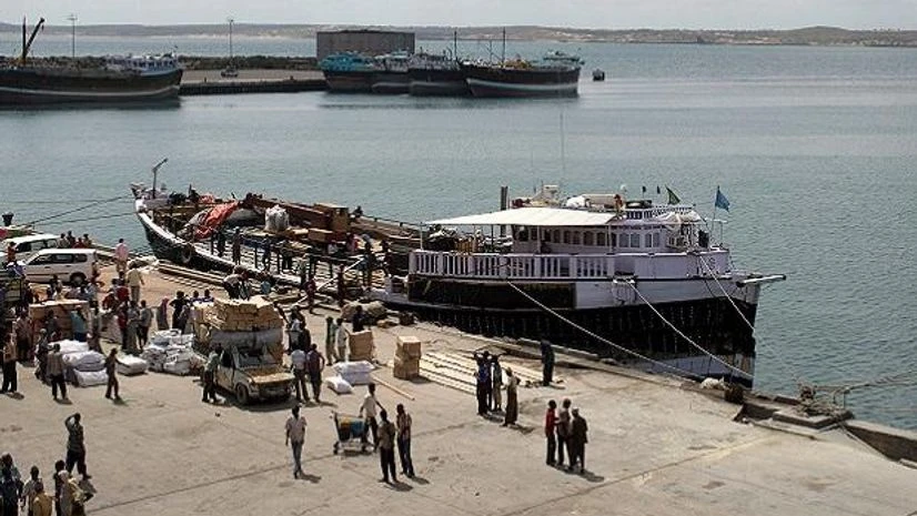 File Photo: Workers stand at the sea port of the coastal town of Kismayu in southern Somalia File Photo: Workers stand at the sea port of the coastal town of Kismayu in southern Somalia