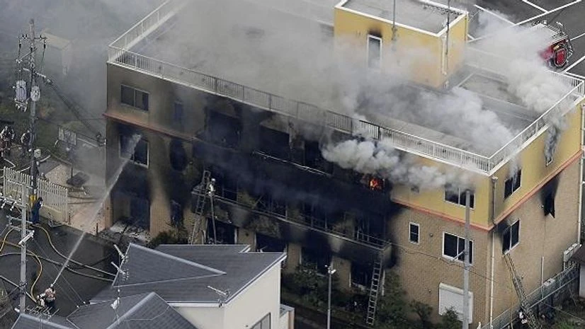 Smoke billows from a three-story building of Kyoto Animation in a fire in Kyoto | Photo: AP/PTI Smoke billows from a three-story building of Kyoto Animation in a fire in Kyoto | Photo: AP/PTI