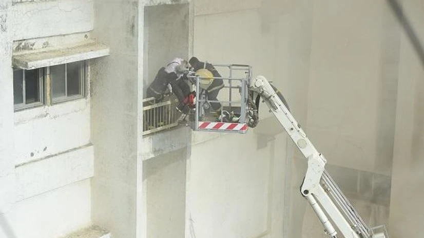 Fire fighters carry out rescue work after a fire broke out at the MTNL building in Bandra, Mumbai, Monday, July 22, 2019. (PTI Photo/Shashank Parade) Fire fighters carry out rescue work after a fire broke out at the MTNL building in Bandra, Mumbai, Monday, July 22, 2019. (PTI Photo/Shashank Parade)