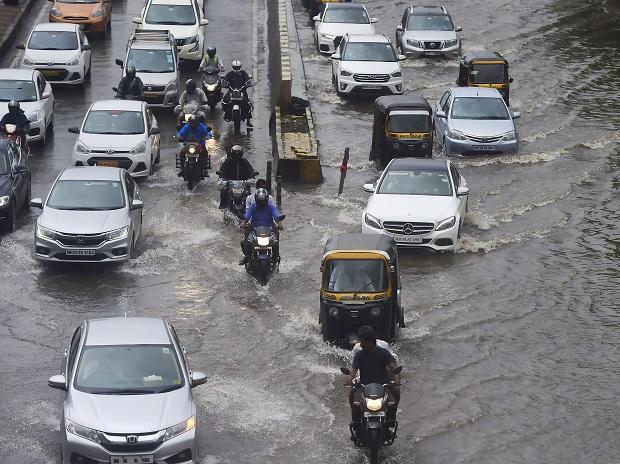 Heavy flooding in some areas delayed local trains and slowed down road traffic movement Heavy flooding in some areas delayed local trains and slowed down road traffic movement