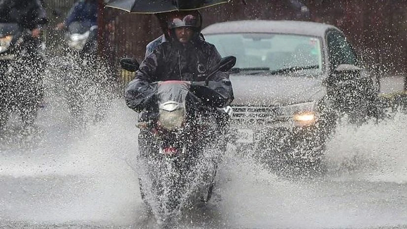 A biker drives through a waterlogged street during heavy monsoon rain at Kings Circle, in Mumbai A biker drives through a waterlogged street during heavy monsoon rain at Kings Circle, in Mumbai
