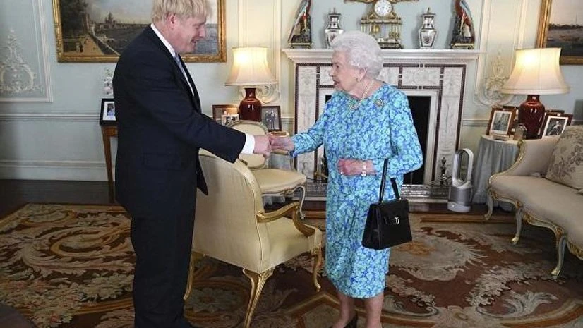 Britain's Queen Elizabeth II welcomes newly elected leader of the Conservative party Boris Johnson during an audience at Buckingham Palace | Photo: AP/PTI Britain's Queen Elizabeth II welcomes newly elected leader of the Conservative party Boris Johnson during an audience at Buckingham Palace | Photo: AP/PTI