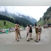 Modi govt committed to ensuring safe, smooth Amarnath Yatra: Amit Shah Indian policemen stand guard at a base camp for a Hindu pilgrimage to the holy cave of Amarnath, where Hindu worship an ice stalagmite that they believe to be the symbol of Lord Shiva, near Pahalgam, in the Kashmir region