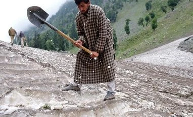 North shivers as Srinagar records lowest temp in 8 years; no relief soon A Kashmiri Muslim man cuts snow to make way for Hindu pilgrims to trek to reach the holy Amarnath cave shrine, where they worship an ice stalagmite that Hindus believe to be the symbol of Lord Shiva, near Pahalgam in the Kashmir region