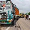 Raebareli: People stand near the site of accident in which the Unnao rape survivor was seroiusly injured after the car in which she was travelling collided with a truck, near Raebareli, Sunday, July 28, 2019. The rape survivor, who had accused BJP ML