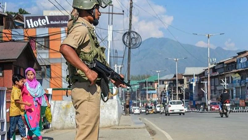 A CRPF jawan stands guard as situation in Kashmir continues to be tense and uncertain, in Srinagar, Sunday, Aug. 4, 2019. There are apperhenensions of prolonged law and order problem in the Valley | Photo: PTI A CRPF jawan stands guard as situation in Kashmir continues to be tense and uncertain, in Srinagar, Sunday, Aug. 4, 2019. There are apperhenensions of prolonged law and order problem in the Valley | Photo: PTI