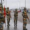 Army personnel stand guard during restrictions, in Jammu, Monday, Aug 05, 2019.Restrictions and night curfews were imposed in several districts of Jammu and Kashmir as the Valley remained on edge with authorities stepping up security deployment.