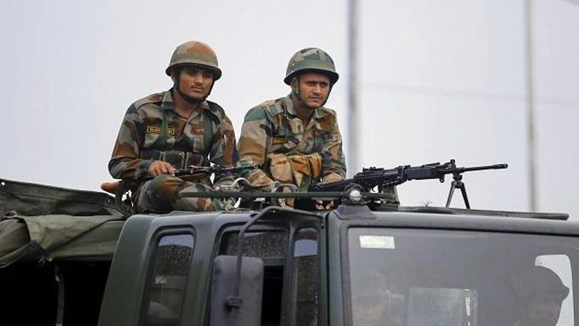 soldiers, army, security Army personnel stand guard during restrictions, at Bikram Chowk in Jammu, Monday, Aug 05, 2019 | Photo: PTI