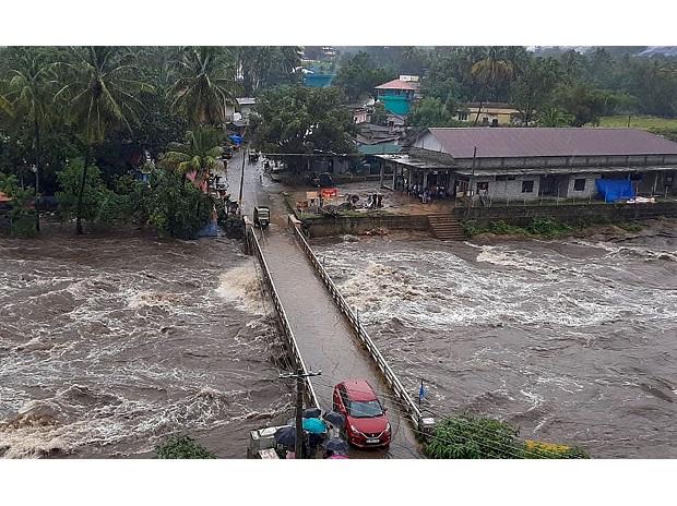 Flood water rushes from under the Kovilkadav Bridge, in Munnar Flood water rushes from under the Kovilkadav Bridge, in Munnar