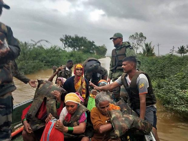 Flood victims are rescued on a boat during a coordinated relief and rescue operations by Army Forces in flood-affected areas of Belgaum district Flood victims are rescued on a boat during a coordinated relief and rescue operations by Army Forces in flood-affected areas of Belgaum district