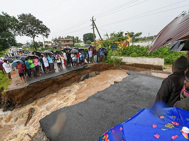 Locals stranded as a part of the road collapsed after water from Kabini reservoir in HD Kote was released following heavy monsoon rainfall, in Mysore Locals stranded as a part of the road collapsed after water from Kabini reservoir in HD Kote was released following heavy monsoon rainfall, in Mysore