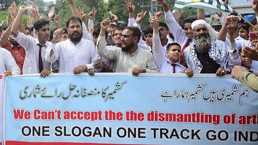 Muzaffarabad: Pakistani Kashmiris attend an anti-India protest in Muzaffarabad, Pakistan, capital of Pakistani Kashmir, Friday, Aug. 9, 2019. Islamabad said it would downgrade its diplomatic ties with New Delhi, expel the Indian ambassador and suspen Kashmir, Article 370