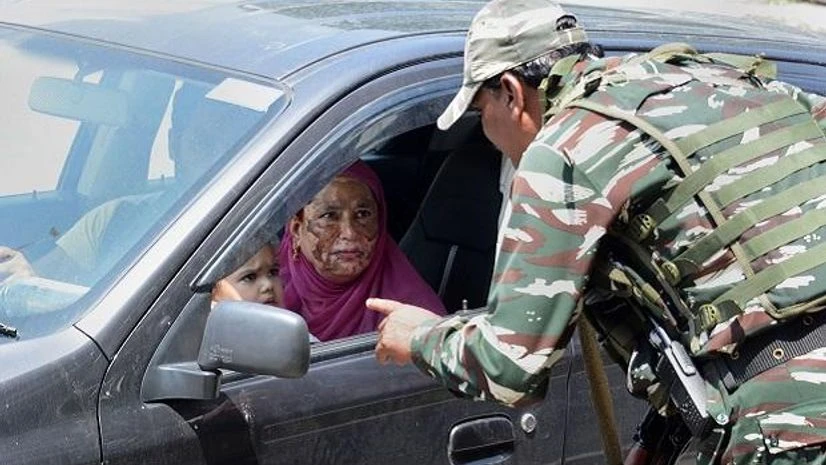 Srinagar: Security personnel stop a vehicle for checking during restrictions in Srinagar, Thursday, Aug 8, 2019. Restrictions have been imposed in several districts of Jammu and Kashmir as a precautionary measure after the state lost its special stat Kashmir, Article 370