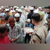 FIR filed against Karnataka seer over remarks on Muslim voting rights A policeman keeps vigil as Muslims gather at Eidgah to offer Eid al-Adha prayers, in Bhopal