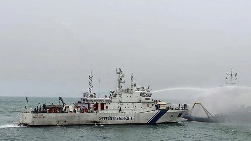 Indian Coast Guard personnel douse the fire that broke out at Offshore Support Vessel 'Coastal Jaguar' off the coast of Visakhapatnam, Monday. The 29-member crew reportedly jumped in the water to save themselves and abandon the burning vessel. 28 of Vizag Ship
